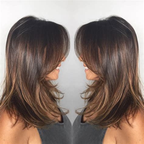 medium length brunette haircuts|medium length layered brown hairstyles.